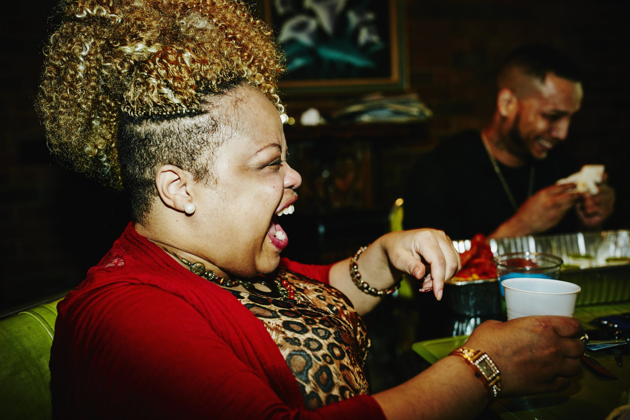 Female laughing in a bar