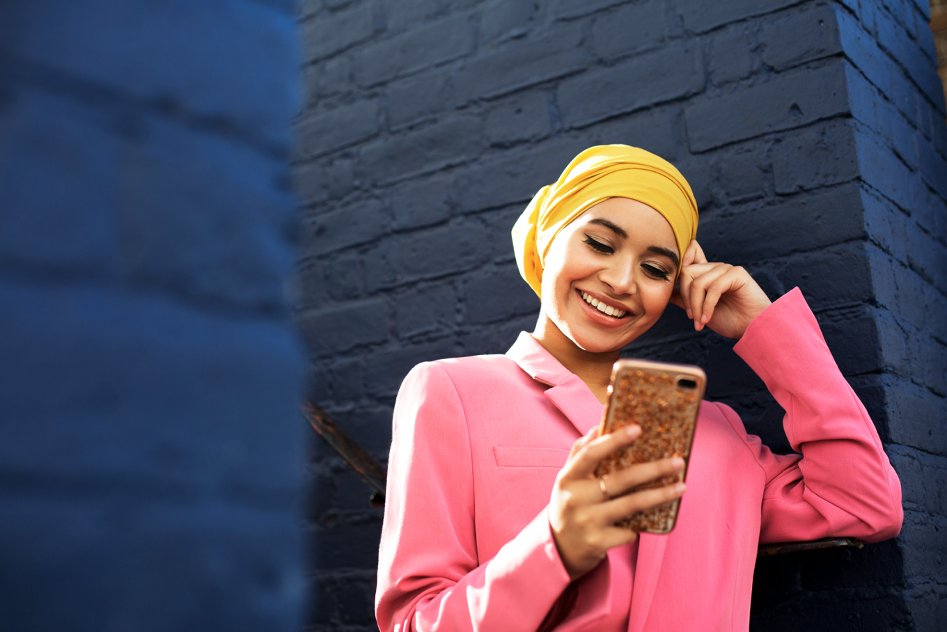 Female in pink jacket on phone